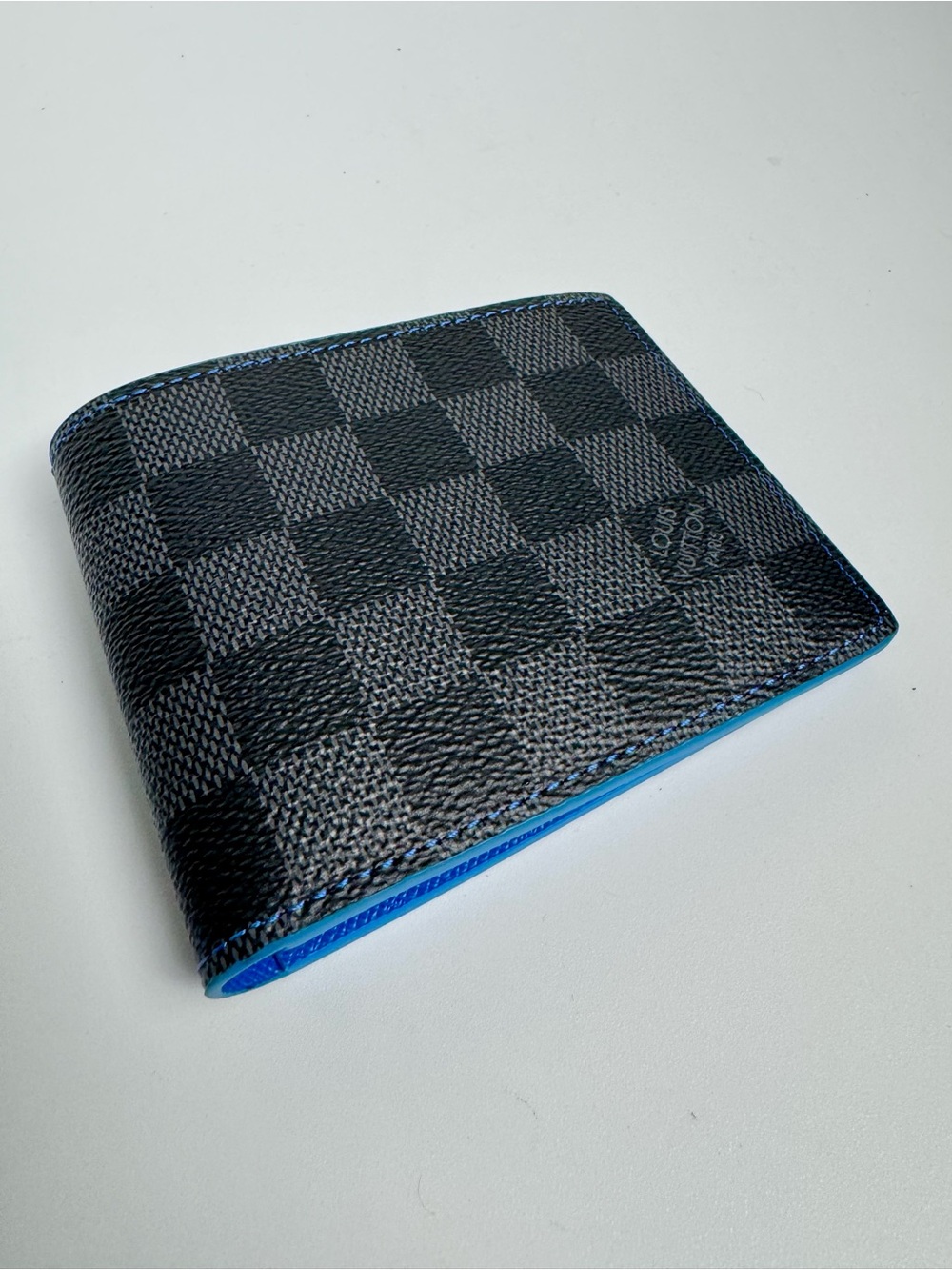 Louis Vuitton Slender Wallet in Damier Graphite canvas with blue leather lining